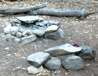 Close up of fire ring and  rock seat at Camp Irene.